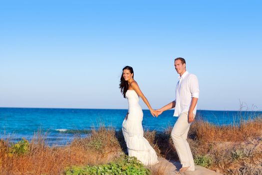 couple in love in the beach dune on Mediterranean sea