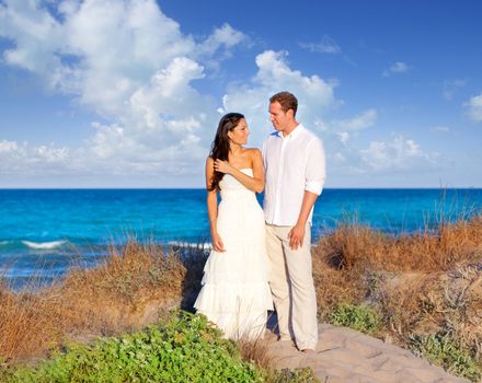 couple in love in the beach dune on Mediterranean sea