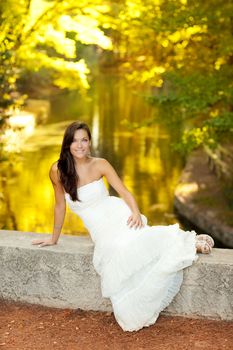 Woman relaxed in autumn golden forest river outdoor