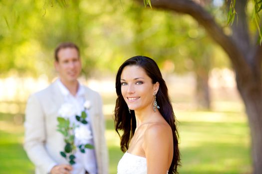 couple just married with man holding flowers in hand