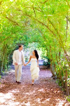 couple just married happy running in green park outdoor