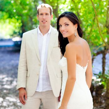 bride just married couple in love at outdoor green park