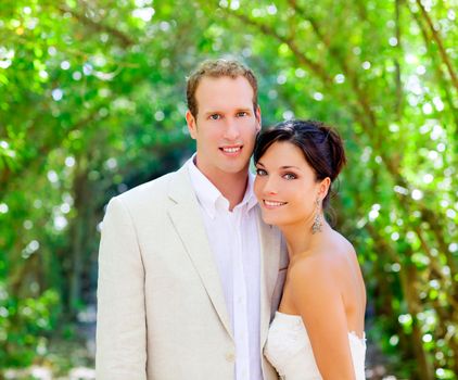 bride just married couple in love at outdoor green park