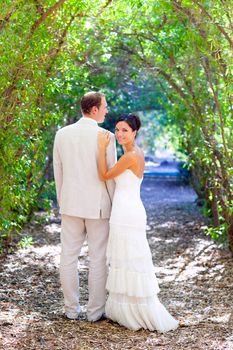 bride just married couple in love at outdoor green park