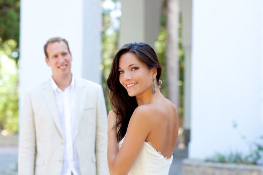 Happy beautiful woman portrait with man in blur background