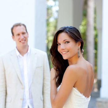 Happy beautiful woman portrait with man in blur background