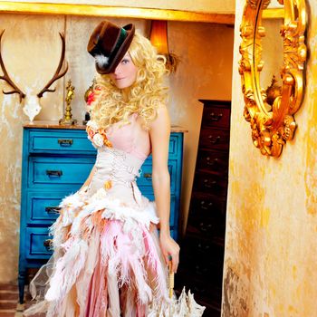 blond fashion woman in vintage grunge baroque house with umbrella