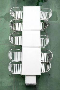 Top view of Metal table and chair with wet floor 