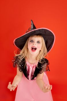 Halloween kid girl costume on orange background