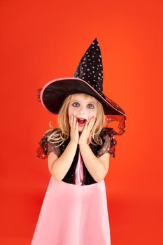 Halloween kid girl costume on orange background