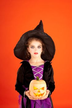 Halloween kid girl costume on orange background