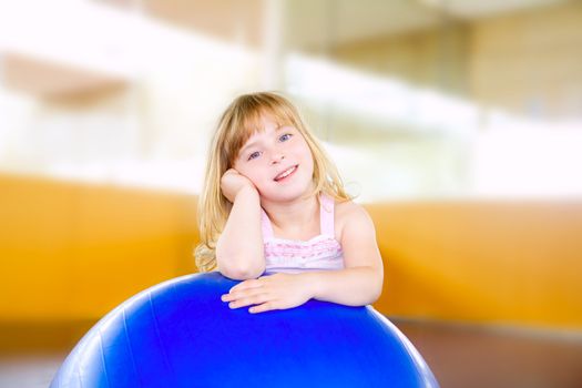 child little girl with gym aerobics ball relaxed