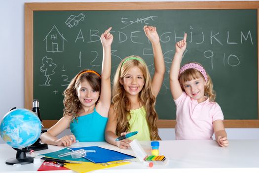 smart group of student kids at school classroom raising hand