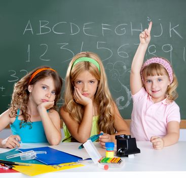 bored students with smart little girl raising hand finger at school