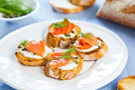 Smoked salmon crostini with cheese,caper and dill