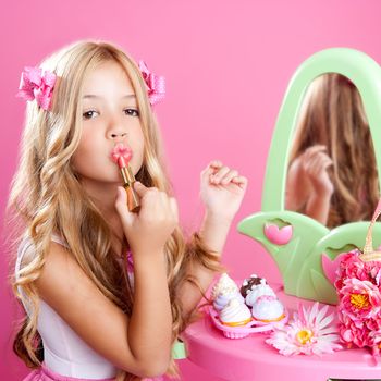 fashion little doll girl in pink vanity mirror with lipstick