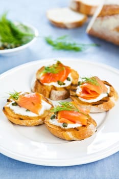 Smoked salmon crostini with cheese,caper and dill