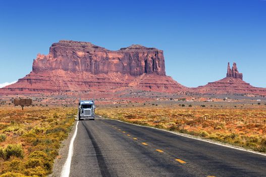 Road leading into Monument Valley. with truck