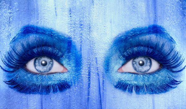 abstract blue eyes makeup woman grunge painted wall texture