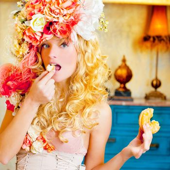baroque fashion blonde woman eating bagel with flowers hat