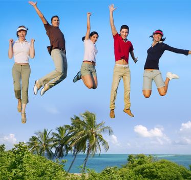 Jumping young people happy group vacation tropical beach