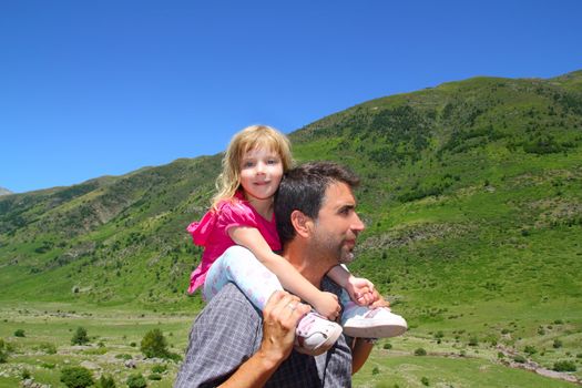 Explorer mountain little girl and father in green outdoor valley landscape