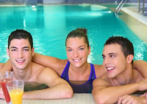 spa young friends group smiling in turquoise pool water