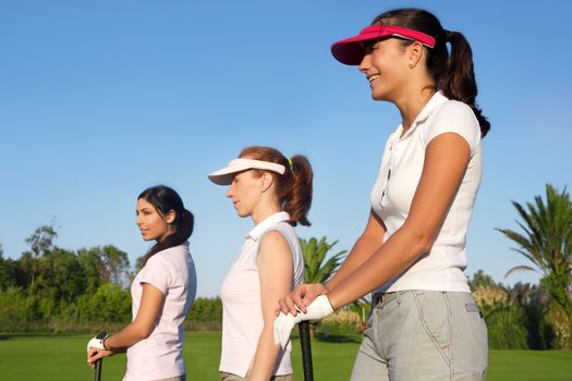 Golf three woman in a row green grass course players