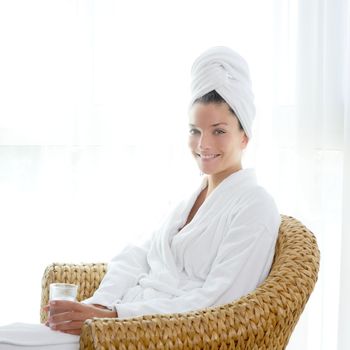 bathrobe beautiful woman sitting relaxed holding glass of water