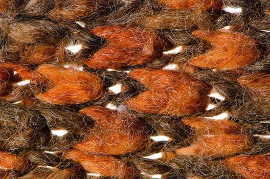 Orange and green knitted wool as background.