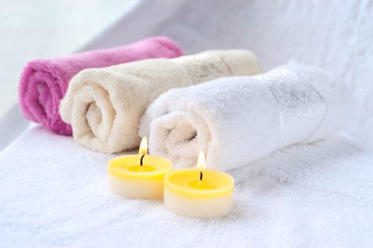 Spa setting with towels and candles