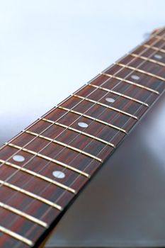 electric guitar - detail of the fret board with shallow depth of field