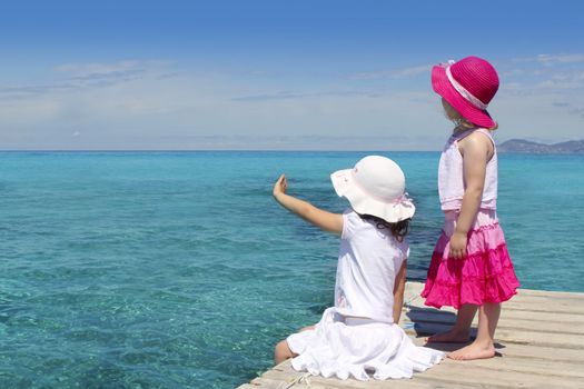 two girls tourist turquoise sea back goodbye boat hand gesture Formentera