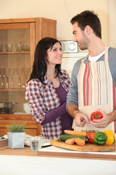 Couple smiling in the kitchen