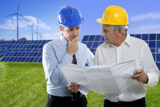 architect engineer two expertise team plan talking hardhat solar plates meadow grass