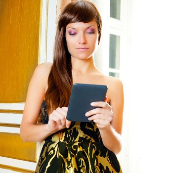 elegance fashion woman reading ebook tablet in golden door
