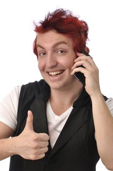 Young man gives a thumbs up as he talks on his smart phone communications device on white background