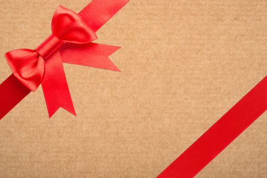 red bow and ribbon over wrapped gift