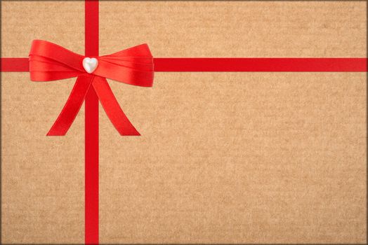 red bow and ribbon over wrapped gift