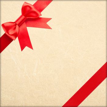 red bow and ribbon over wrapped gift