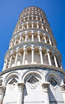 Italy - Pisa. The famous leaning tower on a perfect blue bakcground