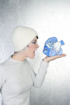 futuristic fashion profile woman shout to blue fish angry gesture silver background