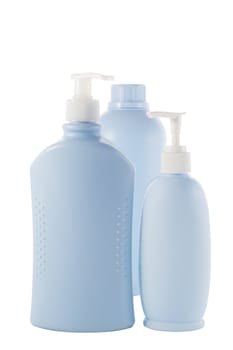 three Hair and Skin care bottles on a white background