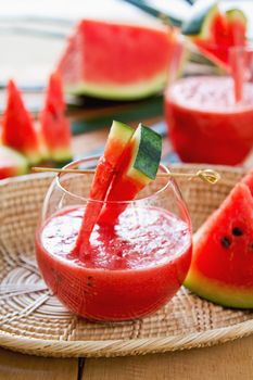 Watermelon juice with some pieces of watermelon