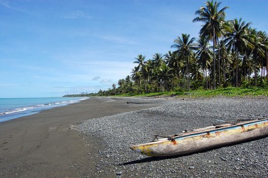 Canoe at ocean coast, Papua New Guinea