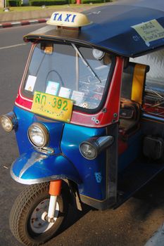 Tuk-tuk taxi vehicle, urban Thailand