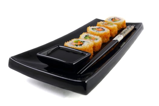 Sushi and wasabi sauce in black plate on the white background