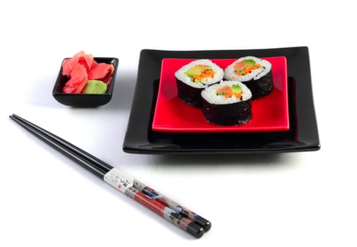 Sushi  in black plate on the white background