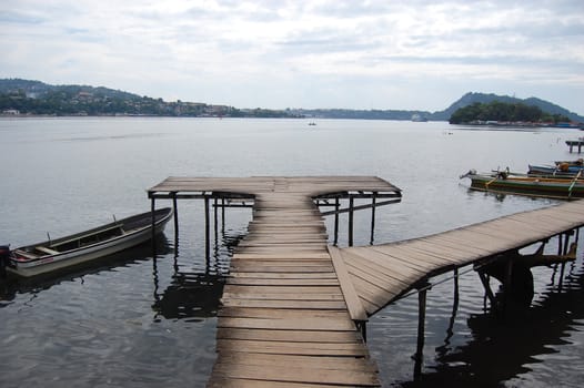 Timber pier and boat, Jayapura, West Papua, Indonesia