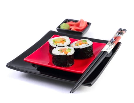 Sushi on black plate on the white background